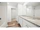 Elegant bathroom with a double granite vanity, wood-look floors and shower at 4437 Ben Hill Rd, Atlanta, GA 30349