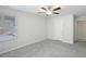 Bright bedroom with plush carpeting, ceiling fan and large window for natural light at 4437 Ben Hill Rd, Atlanta, GA 30349
