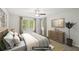 Virtually staged bedroom with soft natural light, ceiling fan, and window views at 4437 Ben Hill Rd, Atlanta, GA 30349