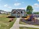 Community playground with clubhouse, benches, and walking path at 4437 Ben Hill Rd, Atlanta, GA 30349