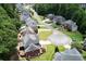 An aerial view showcasing the property's backyard deck and surrounding greenery at 1703 Rifle Sw Rdg, Marietta, GA 30064