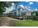 A spacious backyard featuring a deck, screened porch and a well maintained lawn and fence at 1703 Rifle Sw Rdg, Marietta, GA 30064