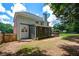 Spacious backyard showcases the back of the home, a screened in porch, and an expansive deck for outdoor living at 1703 Rifle Sw Rdg, Marietta, GA 30064