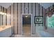 Spacious bathroom featuring dual sinks, soaking tub, and black and white striped wallpaper at 1703 Rifle Sw Rdg, Marietta, GA 30064