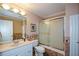 Traditional bathroom featuring a cultured marble double vanity and a shower over bath with glass door at 1703 Rifle Sw Rdg, Marietta, GA 30064