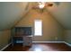 This upper level bedroom features unique vaulted ceilings and hardwood floors at 1703 Rifle Sw Rdg, Marietta, GA 30064