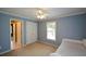 Bedroom featuring blue walls, a ceiling fan, closet and a twin bed at 1703 Rifle Sw Rdg, Marietta, GA 30064