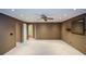 Spacious bonus room with neutral paint, carpet, recessed lighting, and fan, offering versatility for various uses at 1703 Rifle Sw Rdg, Marietta, GA 30064