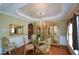 Elegant dining room with hardwood floors, chandelier, and decorative molding at 1703 Rifle Sw Rdg, Marietta, GA 30064