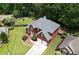 Aerial view of a well-manicured lawn and a two-car garage, showcasing the brick facade at 1703 Rifle Sw Rdg, Marietta, GA 30064