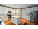 Bright kitchen with white cabinets, stainless steel appliances, and a center island at 1703 Rifle Sw Rdg, Marietta, GA 30064