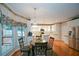 Bright kitchen featuring stainless appliances, a breakfast nook and white cabinets at 1703 Rifle Sw Rdg, Marietta, GA 30064