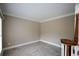Cozy living room featuring neutral walls, tile floor, and natural light from window at 1703 Rifle Sw Rdg, Marietta, GA 30064