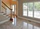 Bright room with tiled flooring, staircase and large windows allowing ample natural light at 1703 Rifle Sw Rdg, Marietta, GA 30064