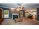 Spacious living room with fireplace, large windows, and open access to the kitchen at 1703 Rifle Sw Rdg, Marietta, GA 30064
