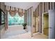Main bathroom boasts a relaxing soaking tub, separate shower, and elegant wallpaper at 1703 Rifle Sw Rdg, Marietta, GA 30064
