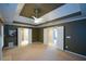 Generous main bedroom with a fireplace, trey ceiling, and access to the en-suite bathroom and walk-in closet at 1703 Rifle Sw Rdg, Marietta, GA 30064