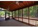 Large screened porch with ceiling fans, offering a serene spot to enjoy the outdoors while avoiding bugs and pests at 1703 Rifle Sw Rdg, Marietta, GA 30064