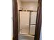 Bathroom shower features glass sliding doors and a gold trim at 2104 Moon Sw Dr, Conyers, GA 30094