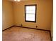 Bedroom features carpeting, a window, and dark trim at 2104 Moon Sw Dr, Conyers, GA 30094