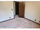 Bedroom with neutral carpeting and a dark trim throughout at 2104 Moon Sw Dr, Conyers, GA 30094