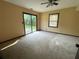 Bedroom featuring sliding glass doors to the outside, natural light, and a ceiling fan at 2104 Moon Sw Dr, Conyers, GA 30094