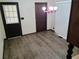 Cozy dining area with neutral walls, modern floors, and a vintage chandelier at 2104 Moon Sw Dr, Conyers, GA 30094