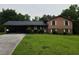 Charming two-story home with a covered carport and well-maintained lawn at 2104 Moon Sw Dr, Conyers, GA 30094