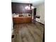 Classic kitchen featuring a unique lighting fixture, wooden bar, and modern flooring at 2104 Moon Sw Dr, Conyers, GA 30094
