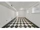 Finished basement with bright walls, tile floors, and ample natural light at 235 The Prado N, Atlanta, GA 30309