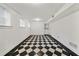 Finished basement with bright walls, tile floors, and ample natural light at 235 The Prado N, Atlanta, GA 30309
