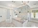 Luxurious bathroom featuring marble floors, free standing soaking tub and a walk-in shower at 235 The Prado N, Atlanta, GA 30309
