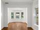 Bright, airy dining room with hardwood floors, large windows, and ample natural light at 235 The Prado N, Atlanta, GA 30309