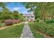 Charming two-story home with a manicured front yard and a stone walkway at 235 The Prado N, Atlanta, GA 30309