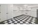 Eat-in kitchen featuring white cabinets and black and white tile floors at 235 The Prado N, Atlanta, GA 30309
