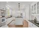 Spacious kitchen with white cabinets, stainless steel appliances and black granite countertops at 235 The Prado N, Atlanta, GA 30309
