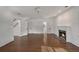 An open-concept living room features a fireplace and multiple doorways to adjacent rooms at 235 The Prado N, Atlanta, GA 30309
