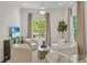 Bright living room with hardwood floors, neutral palette, ample seating and windows at 235 The Prado N, Atlanta, GA 30309