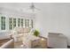 Sunroom with neutral furniture, bright windows, ceiling fan and hardwood floors at 235 The Prado N, Atlanta, GA 30309