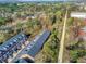 Aerial view of community showing rows of townhomes and surrounding wooded area at 3901 Old Atlanta Station Se Dr, Atlanta, GA 30339