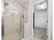 Bathroom with glass enclosed shower and walk-in closet with shelves visible at 3901 Old Atlanta Station Se Dr, Atlanta, GA 30339