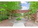 Community pergola with views of lush green space, trees, and manicured landscaping at 3901 Old Atlanta Station Se Dr, Atlanta, GA 30339
