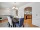 Open dining area with hardwood floors, chandelier, and seamless kitchen access at 3901 Old Atlanta Station Se Dr, Atlanta, GA 30339