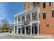 Attractive commercial building with multiple floors, balconies, and prominent signage for 'South City Kitchen' at 3901 Old Atlanta Station Se Dr, Atlanta, GA 30339