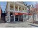 Charming building with multiple levels, balconies, and a red awning for an inviting commercial space at 3901 Old Atlanta Station Se Dr, Atlanta, GA 30339