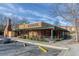 Exterior of Jim 'N Nick's Bar-B-Q with ample parking and outdoor seating at 3901 Old Atlanta Station Se Dr, Atlanta, GA 30339