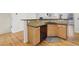 Kitchen area with wood cabinets, granite countertops, stainless steel appliances, and hardwood flooring at 3901 Old Atlanta Station Se Dr, Atlanta, GA 30339