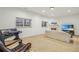 Cozy living room with fireplace, plush sofa, and large windows with views at 3901 Old Atlanta Station Se Dr, Atlanta, GA 30339