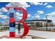 SunTrust Park with the large 'B' statue in foreground against a blue sky at 3901 Old Atlanta Station Se Dr, Atlanta, GA 30339