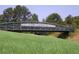Bridge on the Silver Comet Trail amidst a vibrant green meadow at 3901 Old Atlanta Station Se Dr, Atlanta, GA 30339